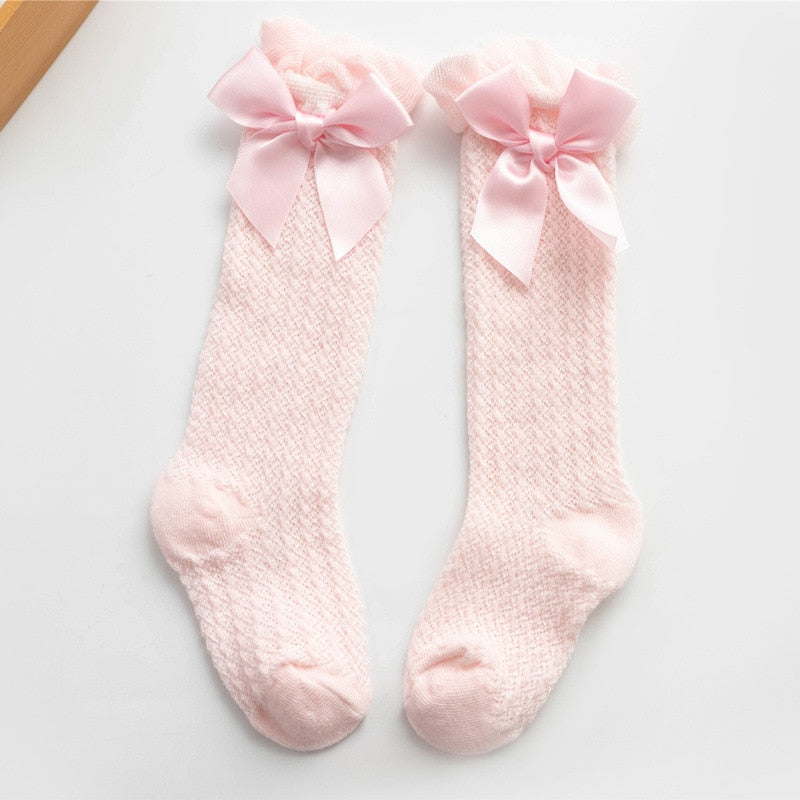 Pink openwork knee socks with satin bows