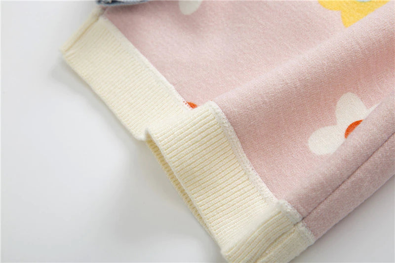 Close-up of ribbed hem on pink sweater