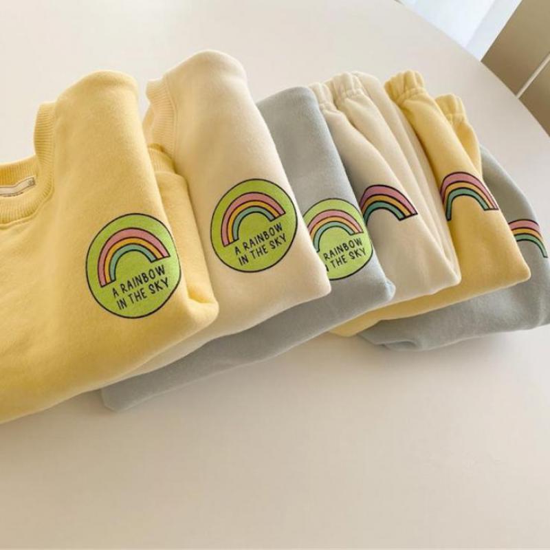 Stack of folded rainbow sweatshirts