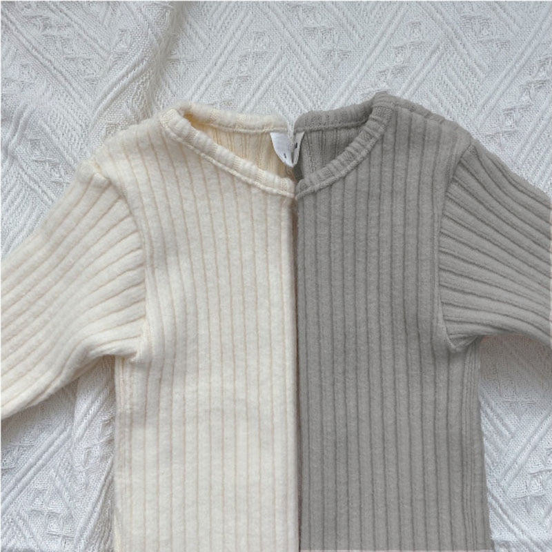 Close-up of white and gray ribbed knit