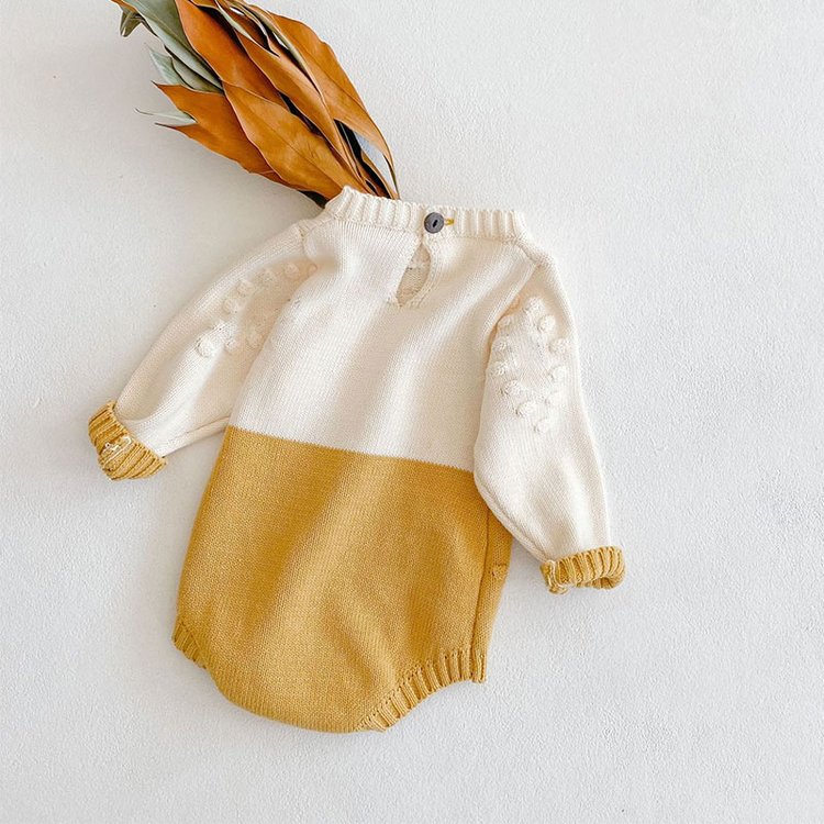 Back of sunflower knit bodysuit with feathers