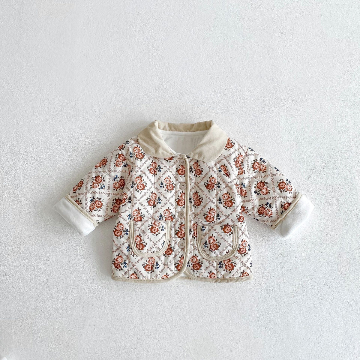 White floral quilted baby jacket