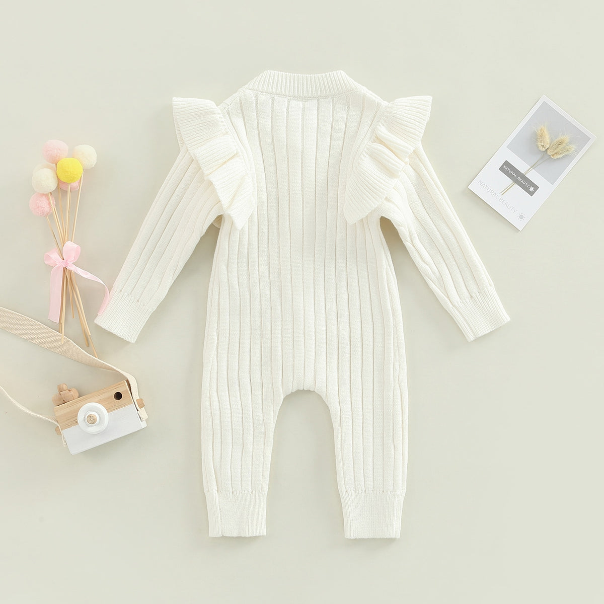 Back view of white ruffle knit jumpsuit