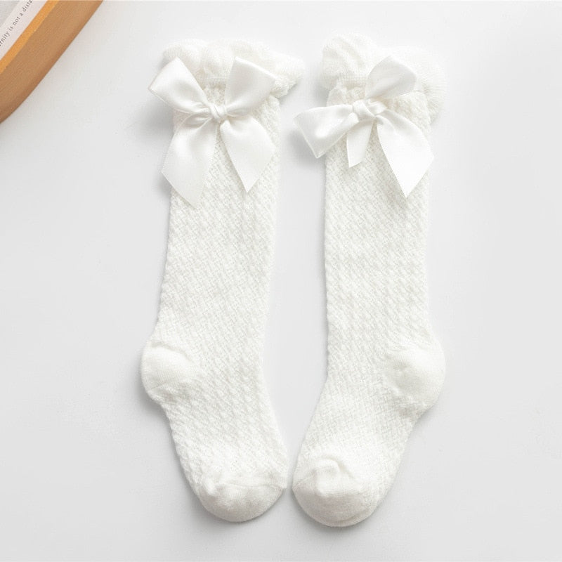 White openwork knee socks with satin bows
