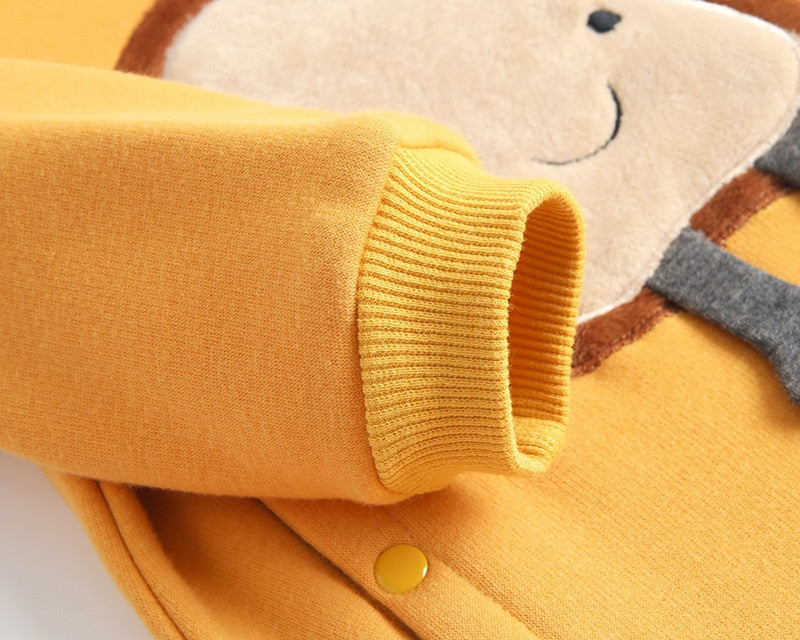 Close-up of ribbed cuff on yellow jumpsuit