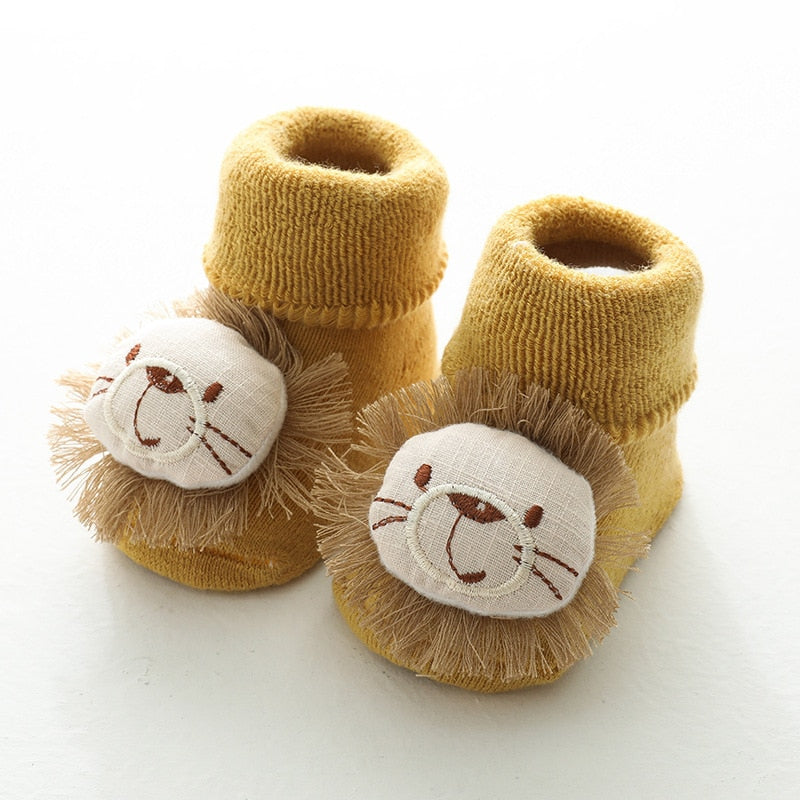 Yellow thick baby socks with lion faces