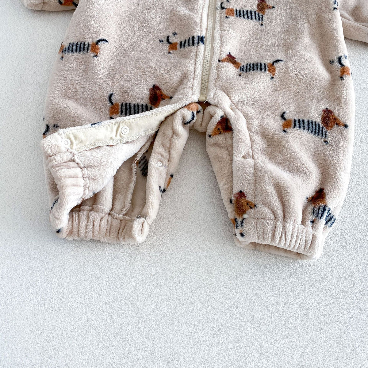 Snap opening along the legs for easy nappy changes