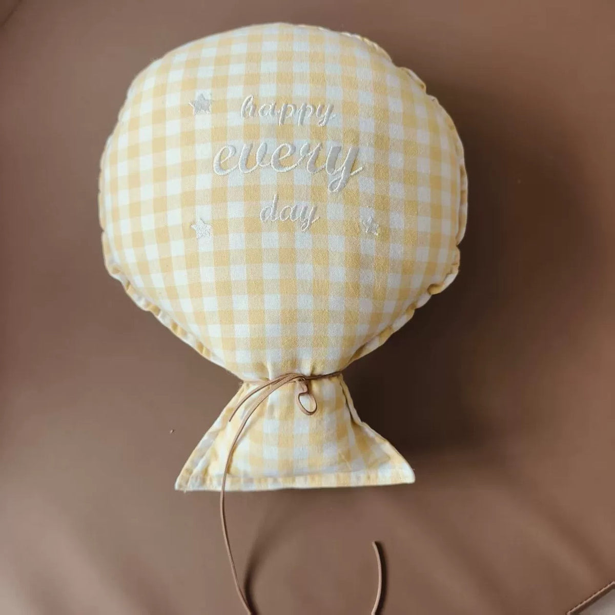 Butter gingham balloon pillow embroidered "happy every day"