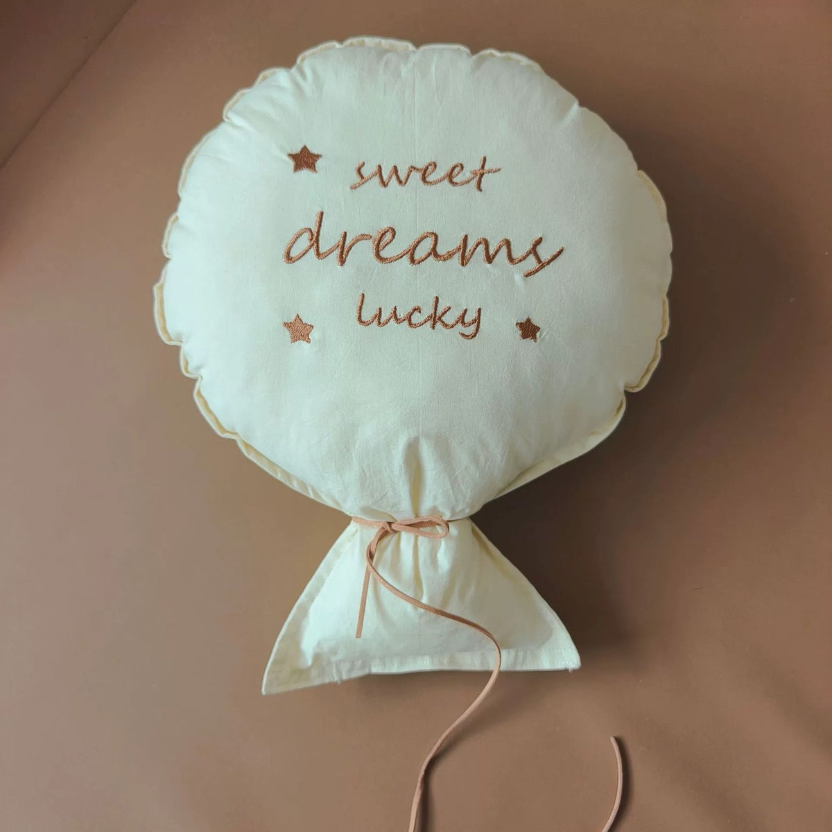 Cream balloon pillow embroidered "sweet dreams lucky"