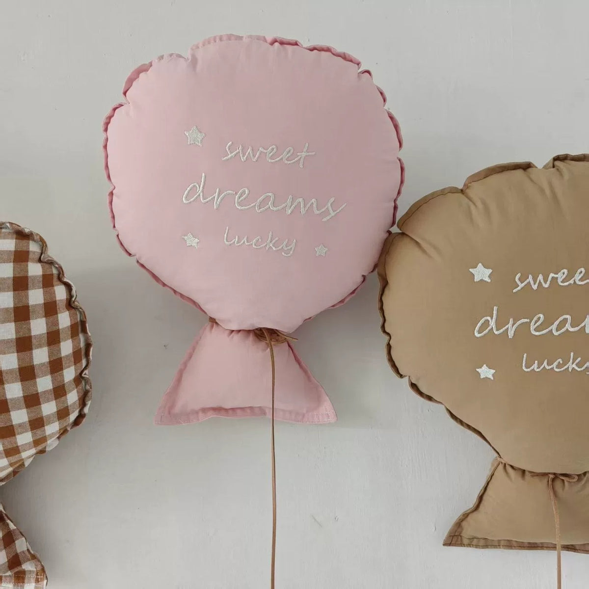 Blush pink balloon pillow embroidered "sweet dreams lucky"
