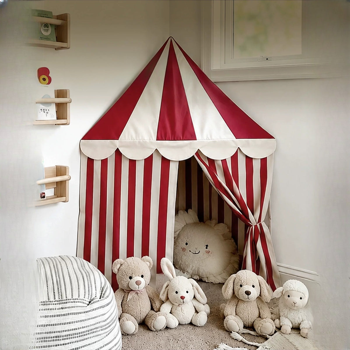 Vintage circus corner tent with plush toys inside, mounted in the corner of a white room