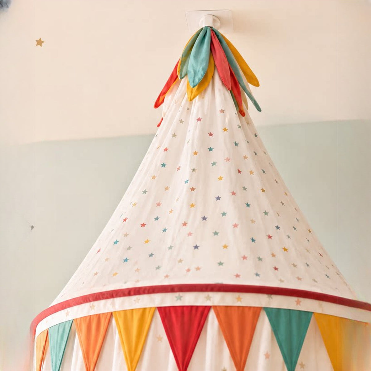 Close-up of the canopy top with colourful fabric petals and the adhesive ceiling hook