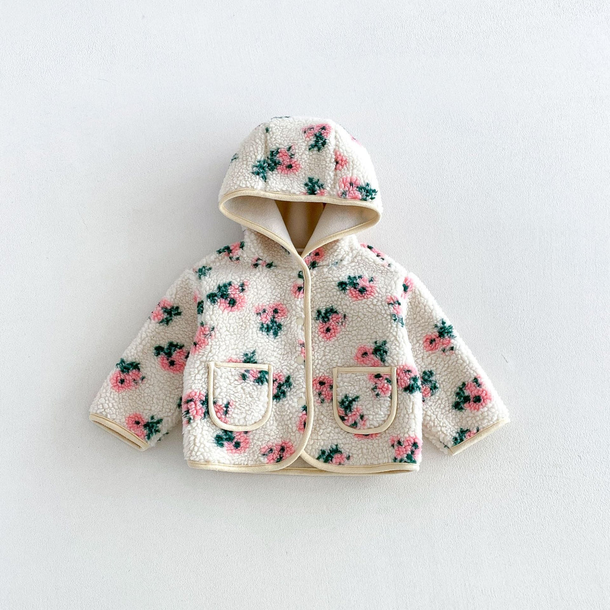 Cream hooded sherpa jacket with pink roses and patch pockets, flat lay
