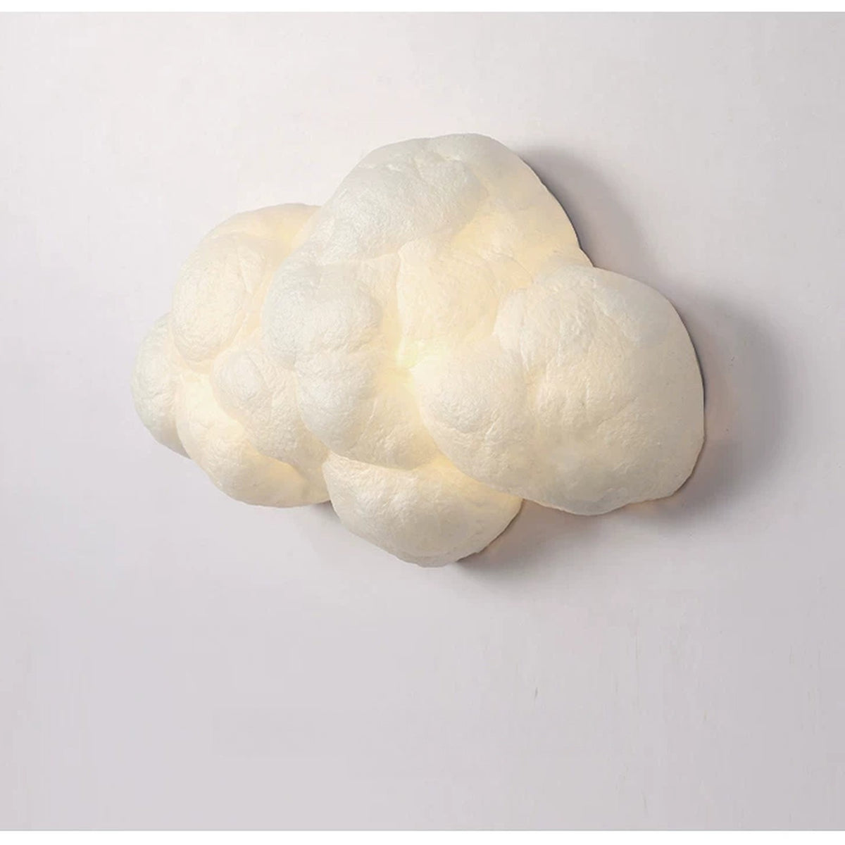 Side view of the lit cloud lamp showing its puffy 3D shape