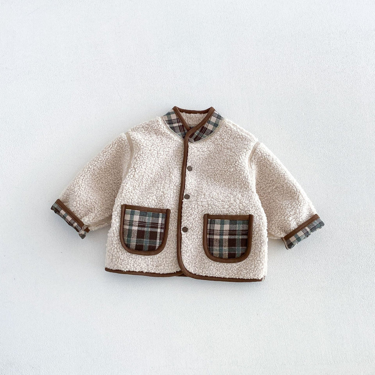 Cream sherpa side of the forest plaid reversible jacket with plaid patch pockets