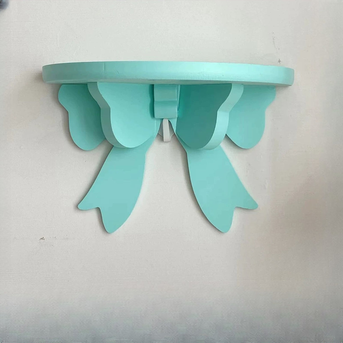 Mint green bow wall shelf
