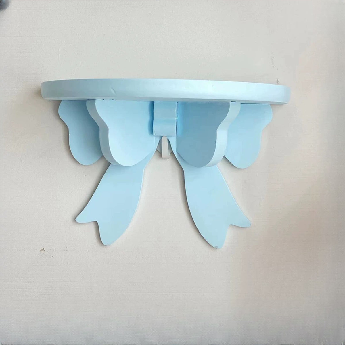Sky blue bow wall shelf