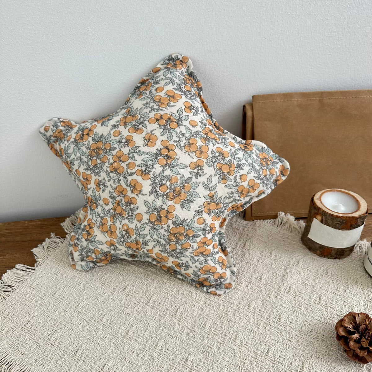 Marigold orange floral star cushion