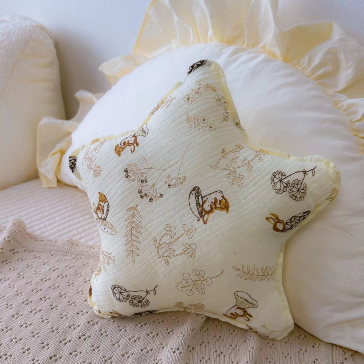 Woodland Bunny print star cushion with mushrooms and rabbits