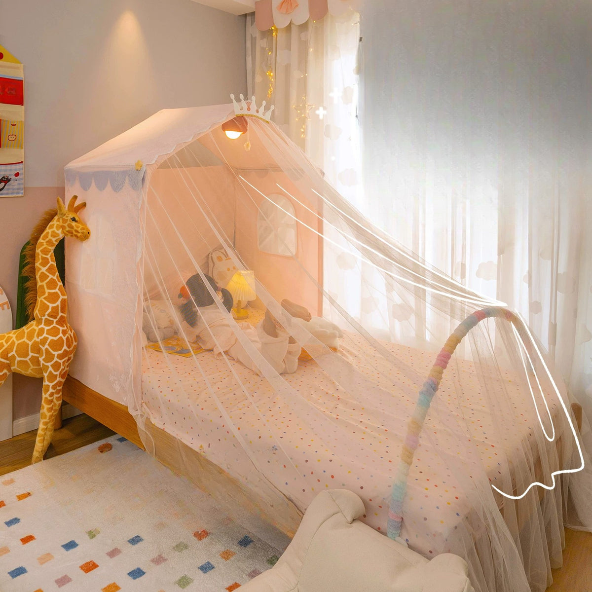 Rainbow arch holding the sheer canopy over the foot of the bed