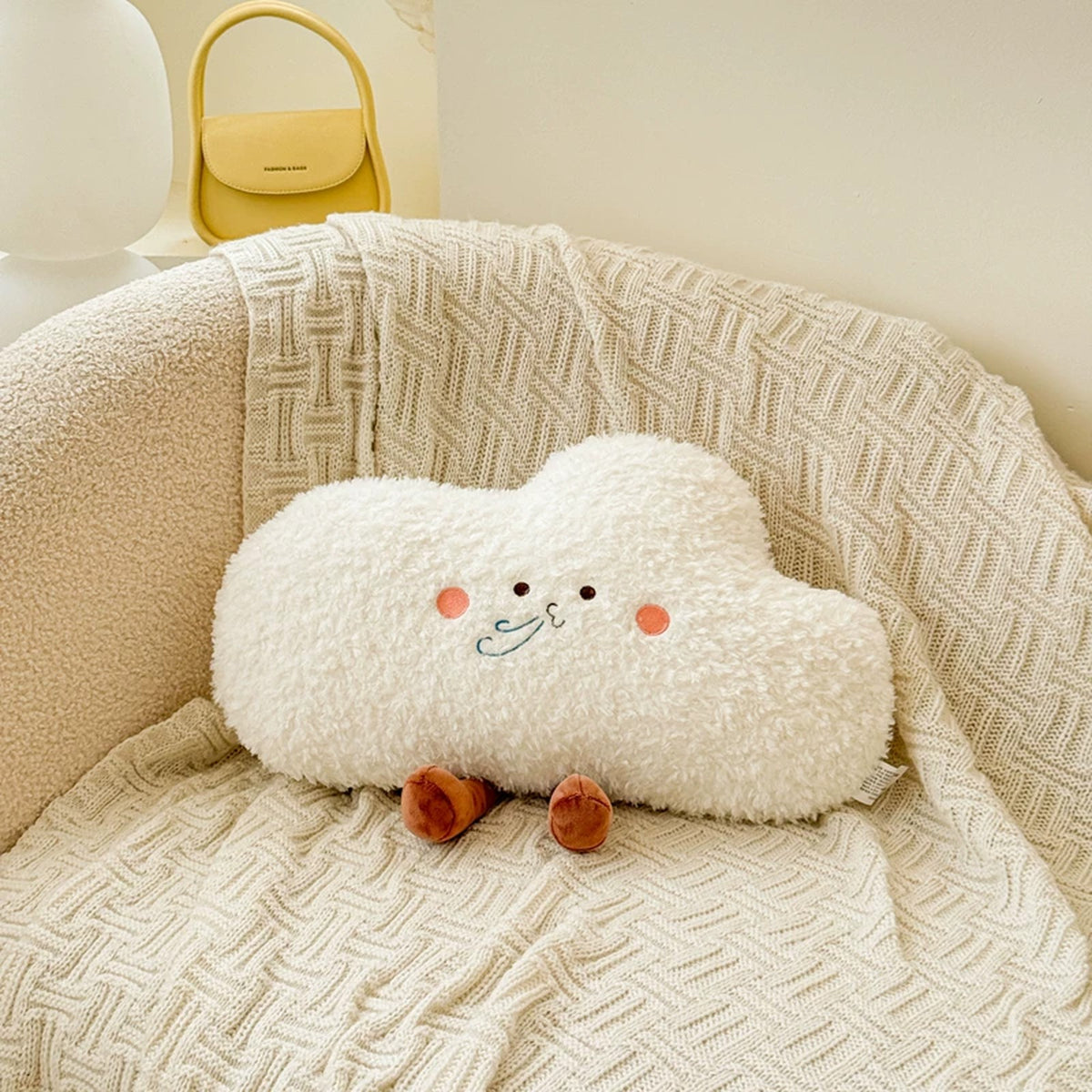 White fluffy cloud plush cushion with a sweet face
