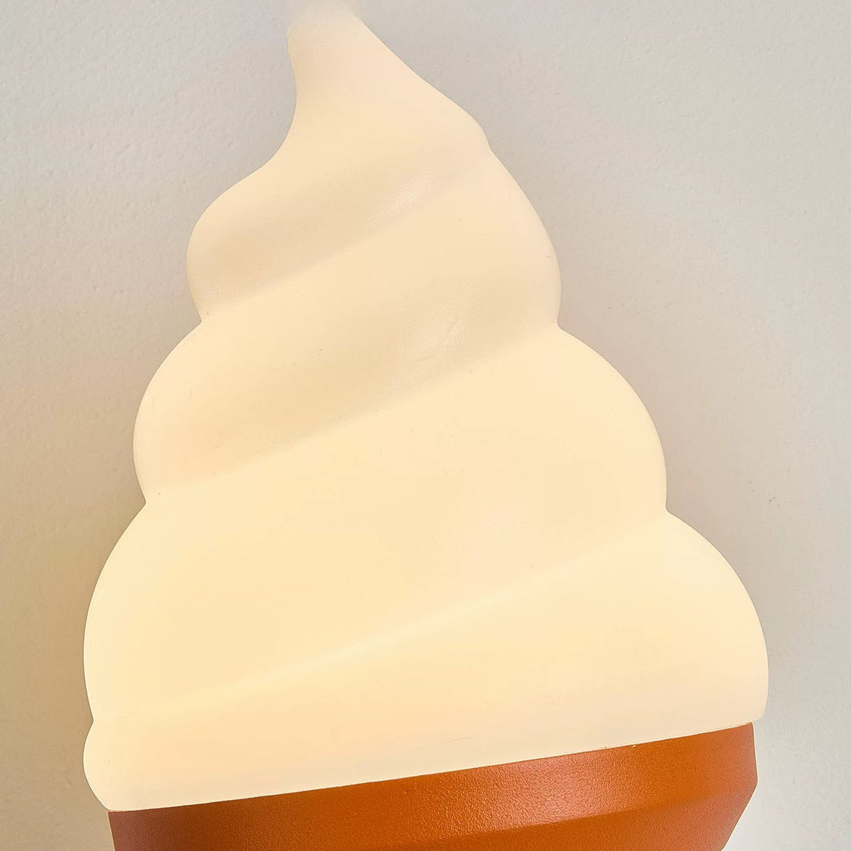 Close-up of the frosted soft-serve lampshade glowing