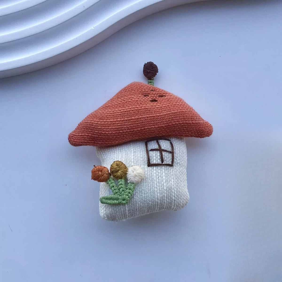 Little house fabric pin with terracotta roof and embroidered flowers