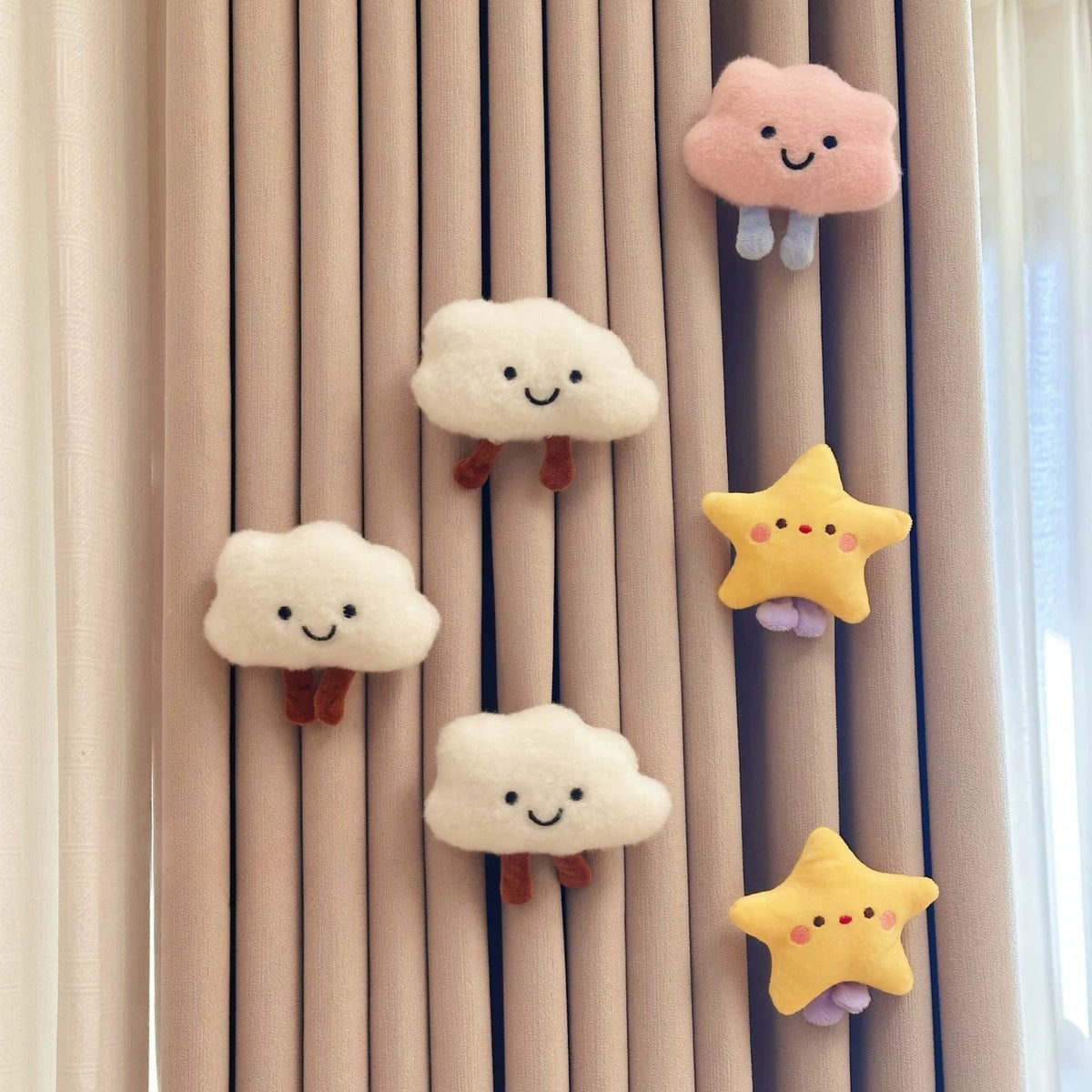 Pink and white plush clouds with yellow stars on a curtain