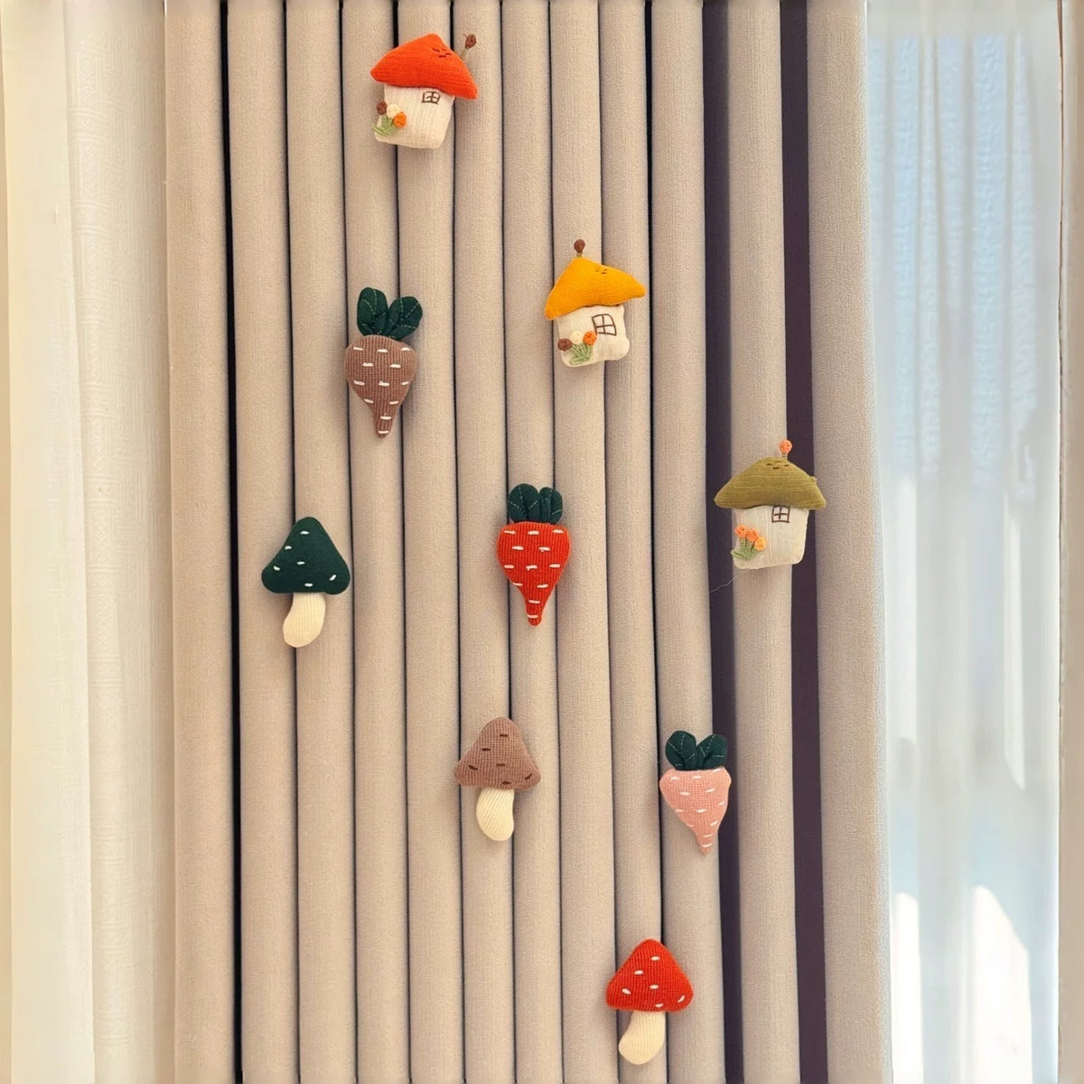 Mushroom Village set: little houses, mushrooms and carrots pinned on a curtain