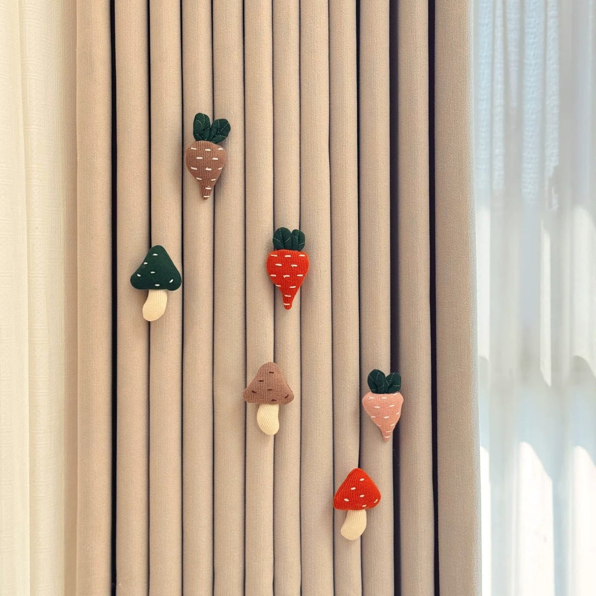 Veggie Patch set: knitted carrots and mushrooms pinned on a curtain