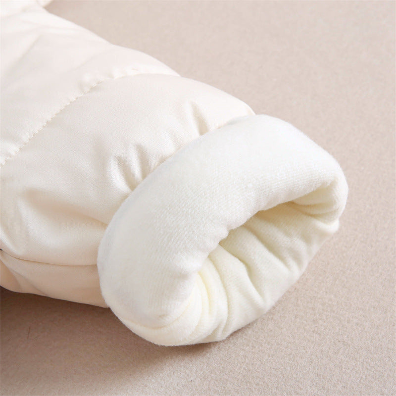 Close-up of the sleeve cuff on a baby romper, showing a soft, plush inner lining in off-white. The cuff is gently rolled, providing extra warmth and comfort for baby's wrists.