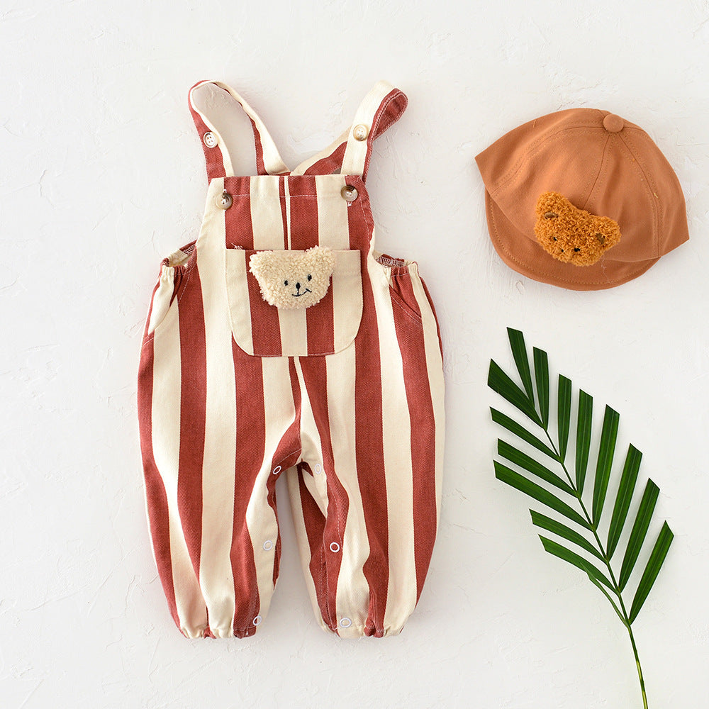 Rust striped baby overalls with teddy bear pocket, styled with matching bucket hat