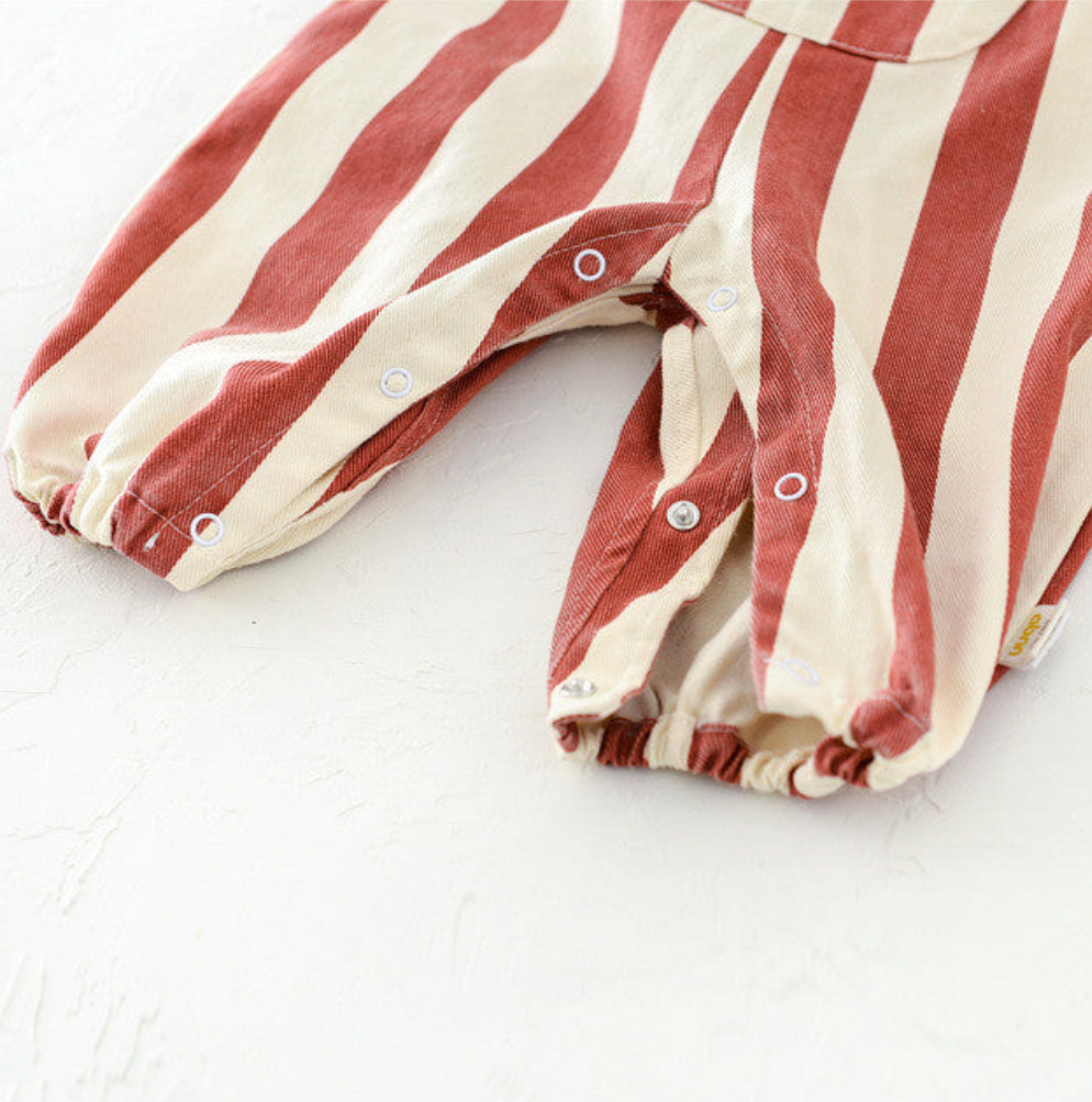 Striped baby overalls leg snap closure detail for easy diaper changing
