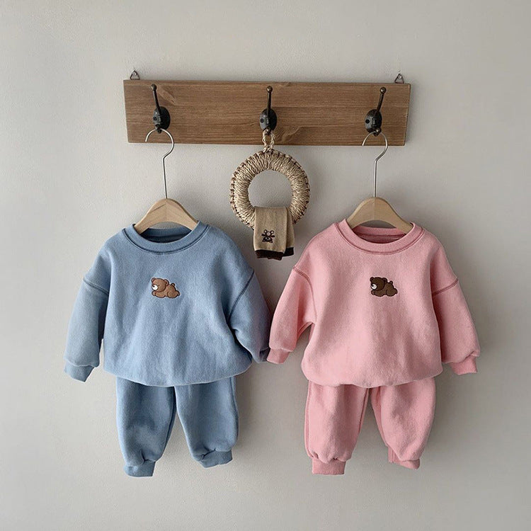 Adorable toddler bear sweater and pants set in pastel blue and pink colors, featuring a cute bear embroidered detail on the front. Cozy and stylish, this casual two-piece outfit is perfect for keeping little ones warm during fall and winter. Ideal for both boys and girls, this set adds a touch of charm to any wardrobe