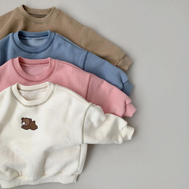 Set of cozy toddler bear sweaters in neutral beige, blue, pink, and ivory, with an adorable bear embroidered on the front. These soft and warm sweatshirts are perfect for casual wear, ideal for fall and winter. Unisex design makes them suitable for both boys and girls, adding a touch of charm to any little one's wardrobe.