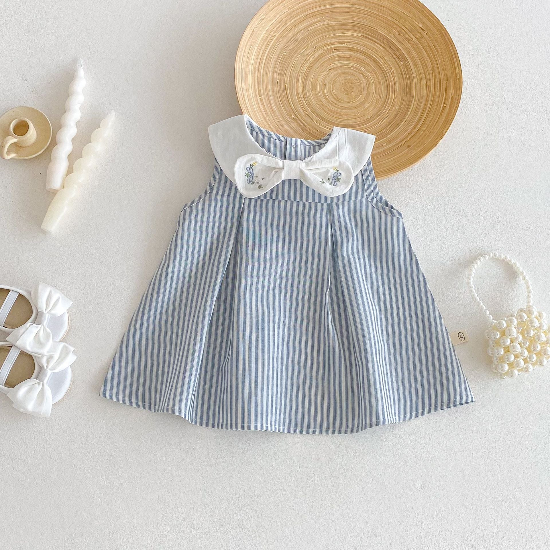 Blue striped baby dress with white Peter Pan collar and embroidered bow