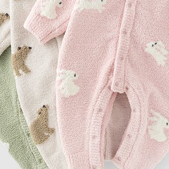 Three plush knit baby rompers with sheep, bears and bunnies