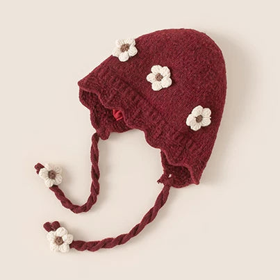 Berry red knit baby girl bonnet with cream crochet flowers