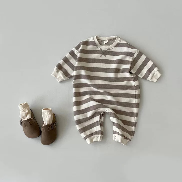 Mocha stripe long-sleeve baby romper flat lay with brown baby shoes