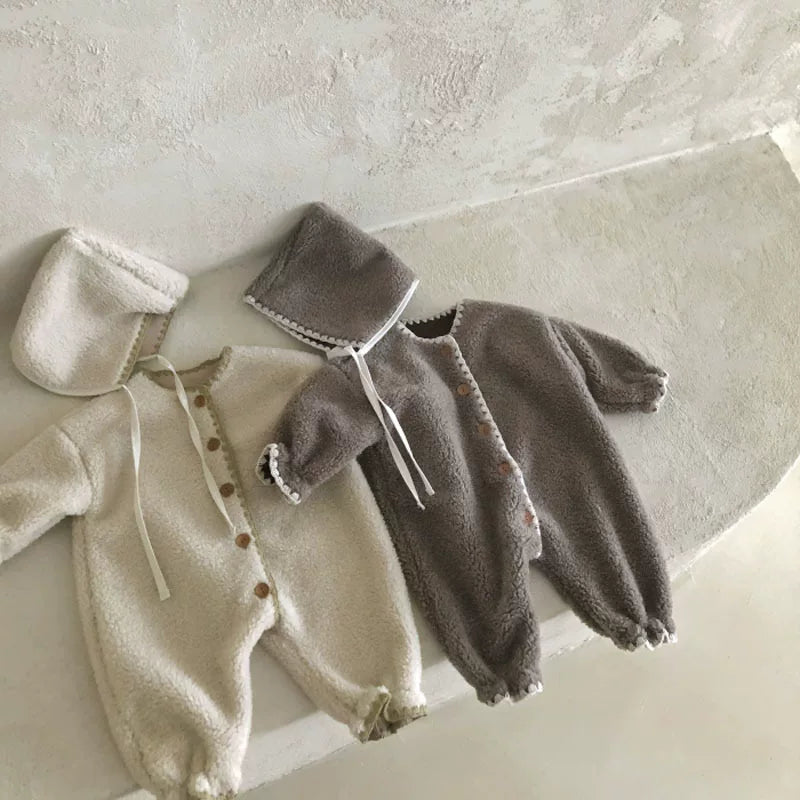 Oat and mocha teddy plush baby rompers with matching bonnets, product shot