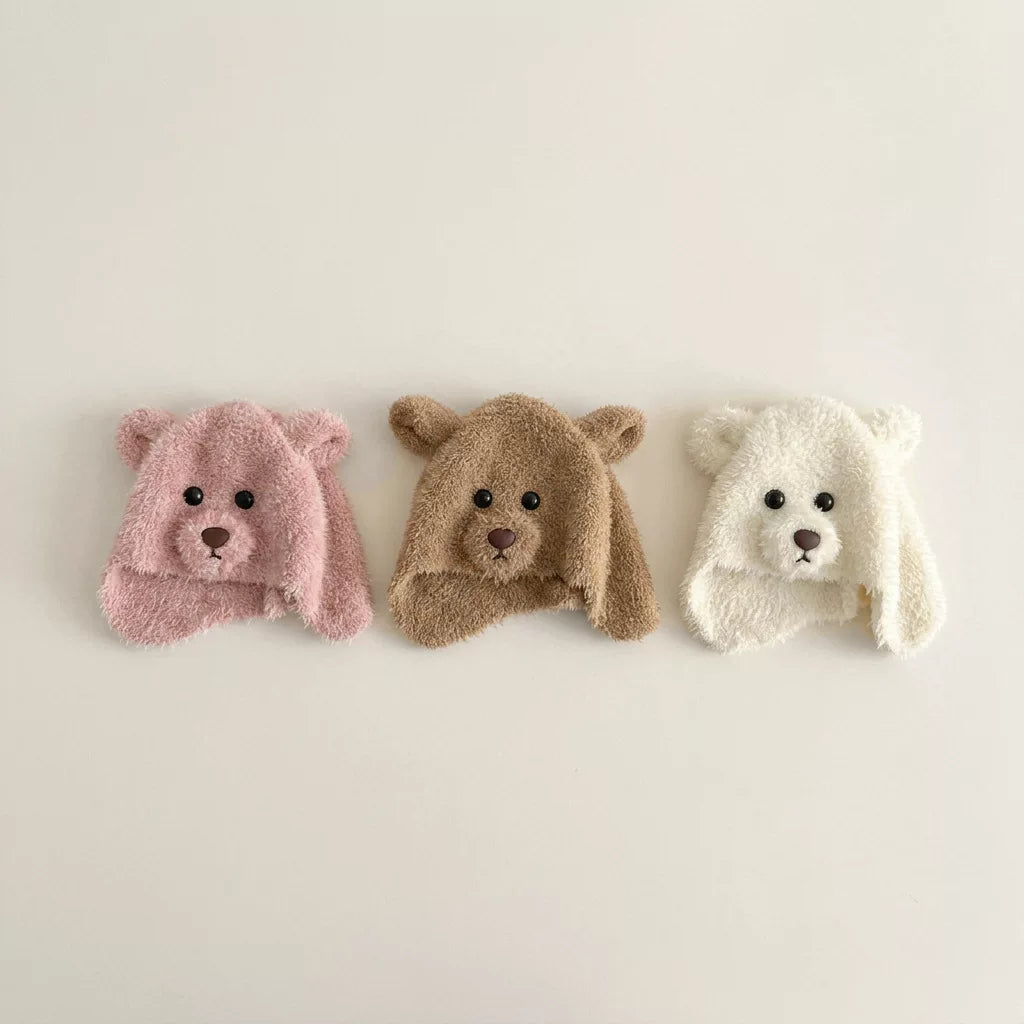 Rose, latte and cream plush bear hats side by side