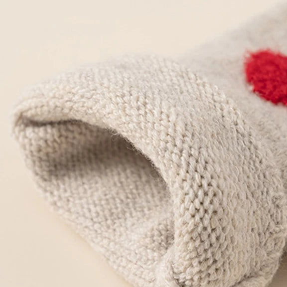 Ribbed cuff detail on strawberry knit cardigan