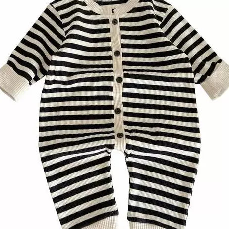 Black and cream striped long-sleeve baby jumpsuit on white