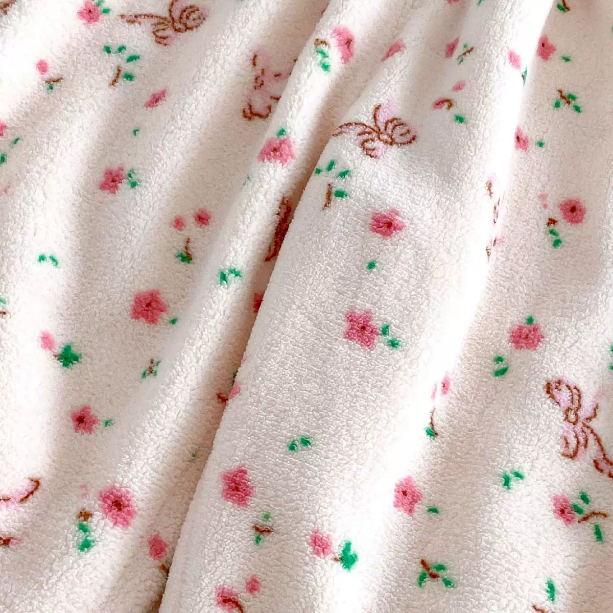 Close-up of plush floral fleece fabric