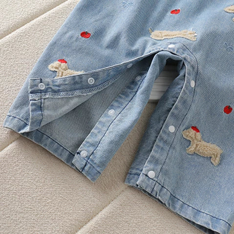 Leg snaps on the denim overalls for easy nappy changes