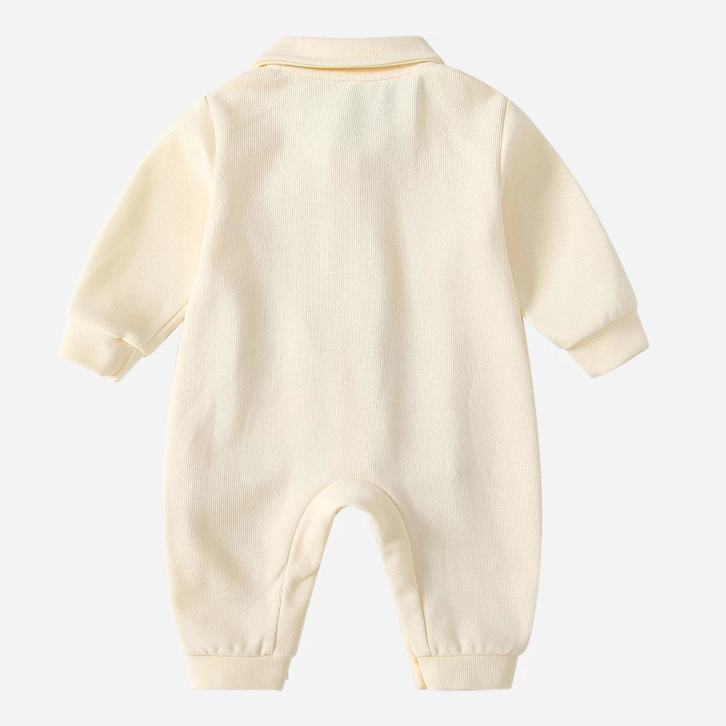 Back view of the cream long-sleeve baby romper with collar