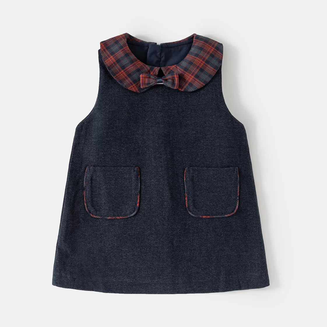 Navy sleeveless pinafore dress with plaid Peter Pan collar, bow and patch pockets