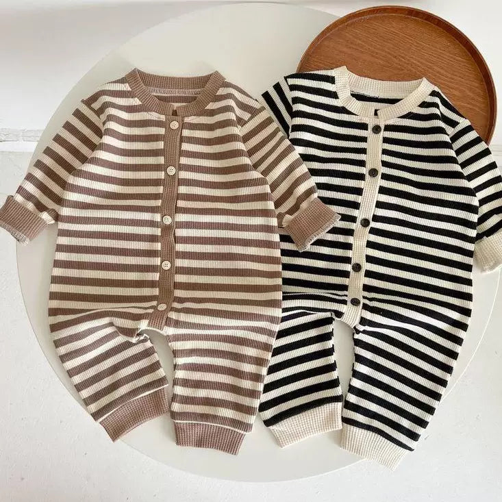 Two striped baby rompers in mocha and ink with contrast cuffs