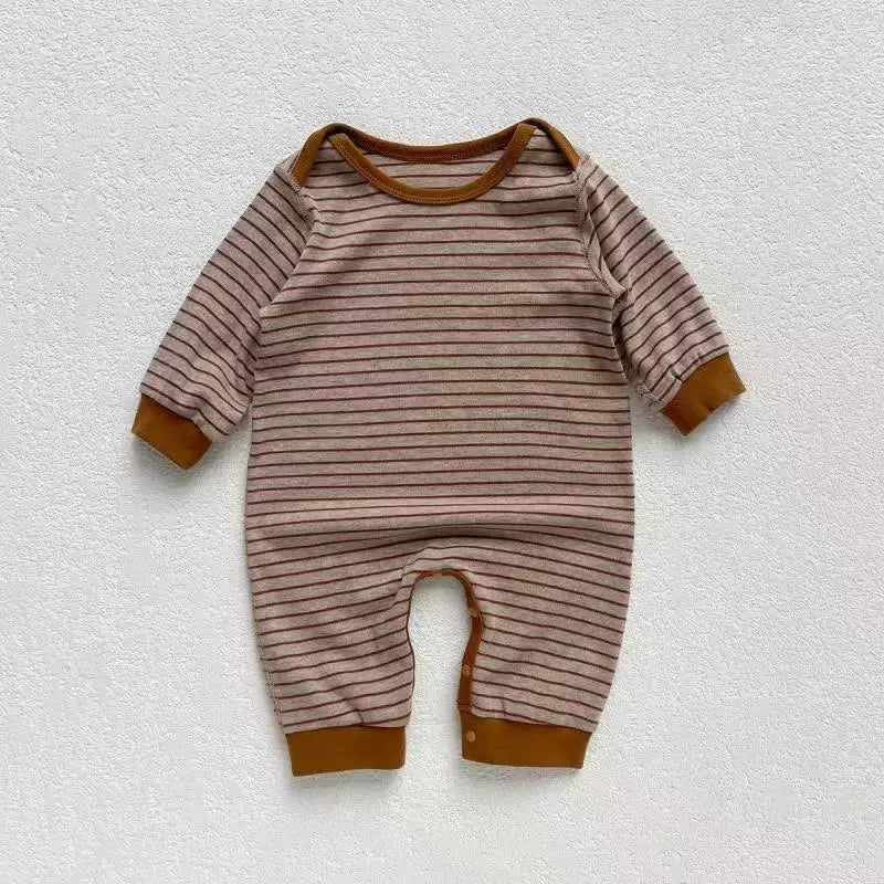Mocha striped baby romper with caramel trim, flat lay
