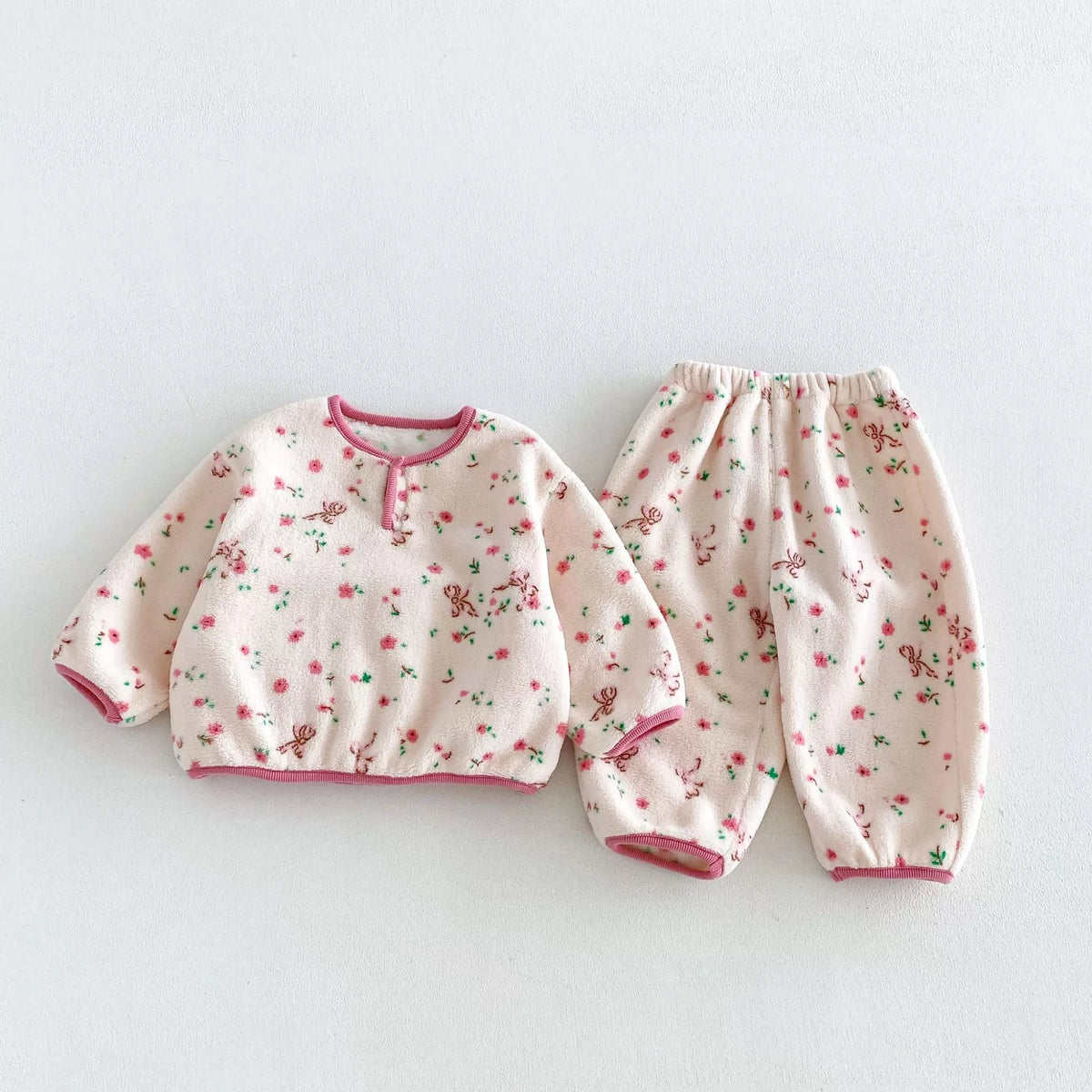 Rose blossom floral fleece pajama top and pants for girls, flat lay